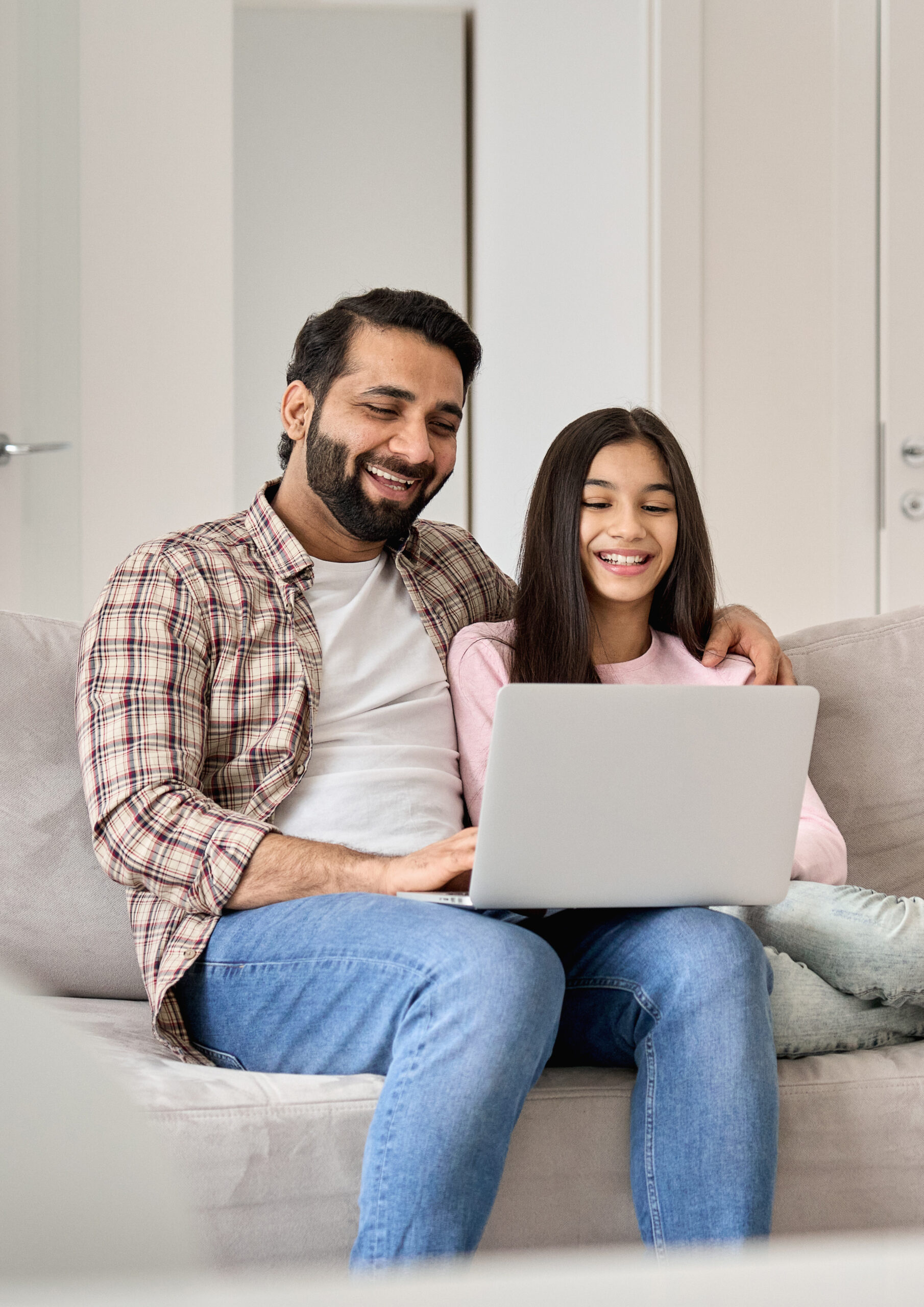 dad with teenage girl in virtual online therapy appointment in NY